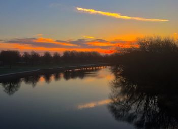 Scenic view of lake against sky during sunset