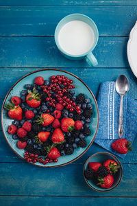 High angle view of strawberries in bowl on table