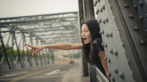 Full length of young woman in mid-air