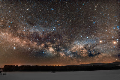 Scenic view of star field against sky at night