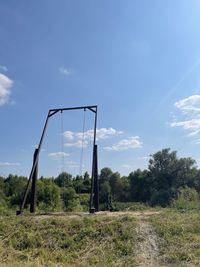 Trees on field against sky
