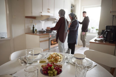 Family cooking together for eid al-fitr at home