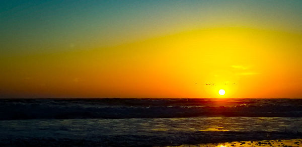 Scenic view of sea against sky during sunset