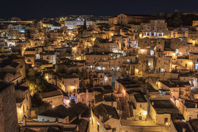 High angle view of illuminated buildings in city at night