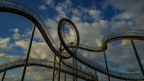 Low angle view of rollercoaster against sky