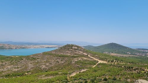 Scenic view of landscape against clear blue sky