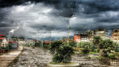 Buildings against cloudy sky