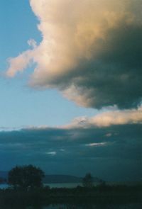 Scenic view of landscape against cloudy sky