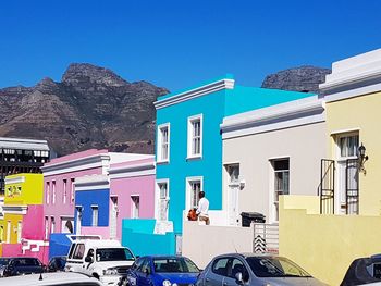 View of buildings against blue sky