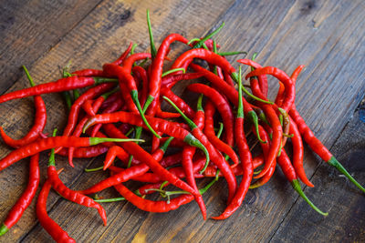 Close-up of red chili peppers on table