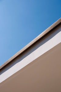 Low angle view of building against clear blue sky