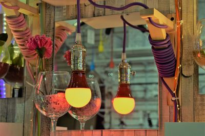 Close-up of wine glass bottles on table