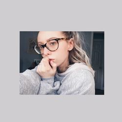 Close-up portrait of woman wearing eyeglasses