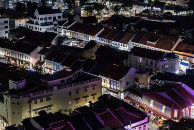 High angle view of illuminated buildings in city at night