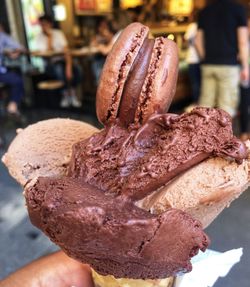 Close-up of hand holding ice cream