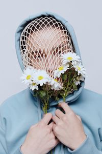 Midsection of woman holding bouquet