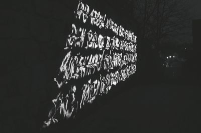 Close-up of hanging at night