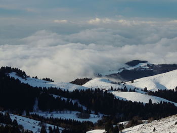 Scenic view of mountains against sky during winter