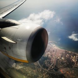 Airplane wing against sky