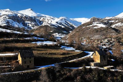 Scenic view of snowcapped mountains against sky