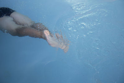 Man swimming in pool