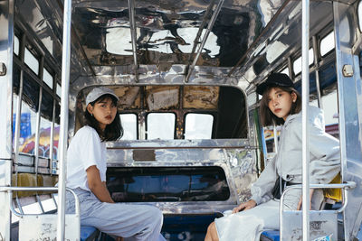 Portrait of woman sitting in bus