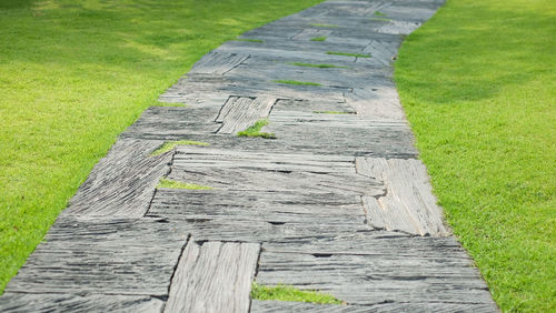 Close-up of wooden posts on field