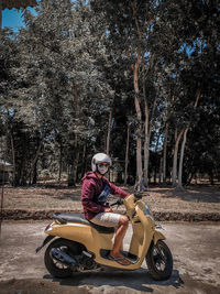 Man riding motorcycle on road