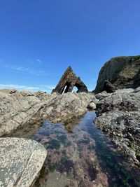 Rock formations against blue sky