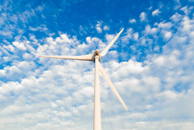 Low angle view of windmill against sky