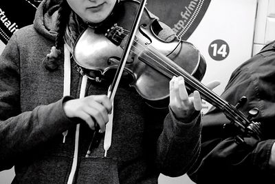 Close-up of woman playing violin