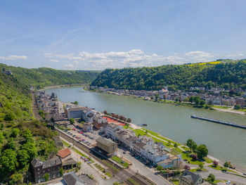 High angle view of river amidst trees against sky