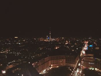 Illuminated cityscape at night