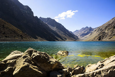 Scenic view of sea and mountains against sky