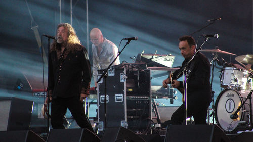Men playing guitar at music concert