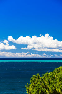 Scenic view of sea against blue sky