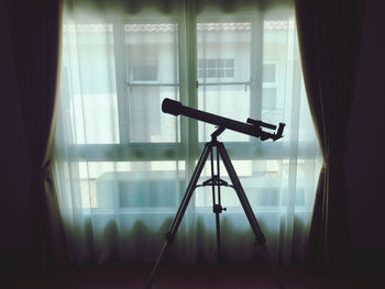 Close-up of electric lamp on table at home