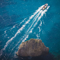 Aerial view of boat sailing in sea