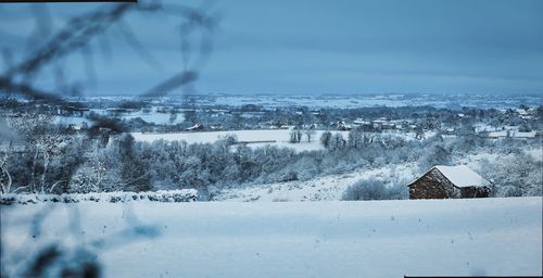 White snow landscape in wintertime with trees in aveyron, france