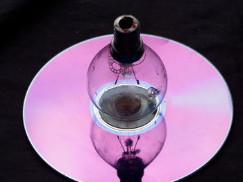 High angle view of glass bottle on table