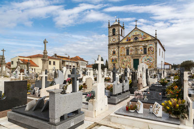 Church and cemetery view against the sky 