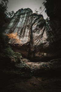 Low angle view of rock formation against sky