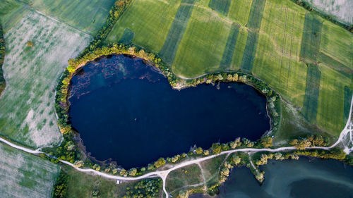 High angle view of lake amidst field