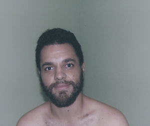 Portrait of smiling man against white background