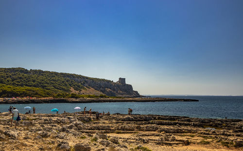 Scenic view of sea against clear blue sky