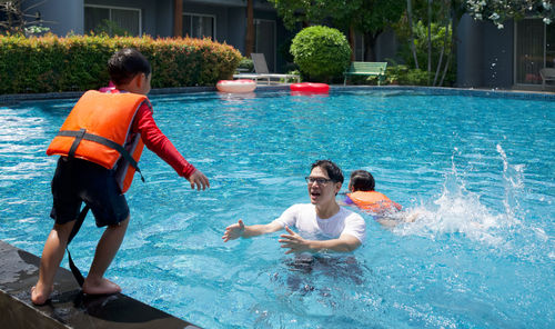 People enjoying in swimming pool