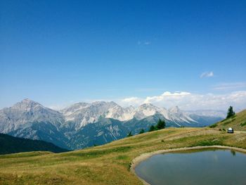 Scenic view of landscape against cloudy sky