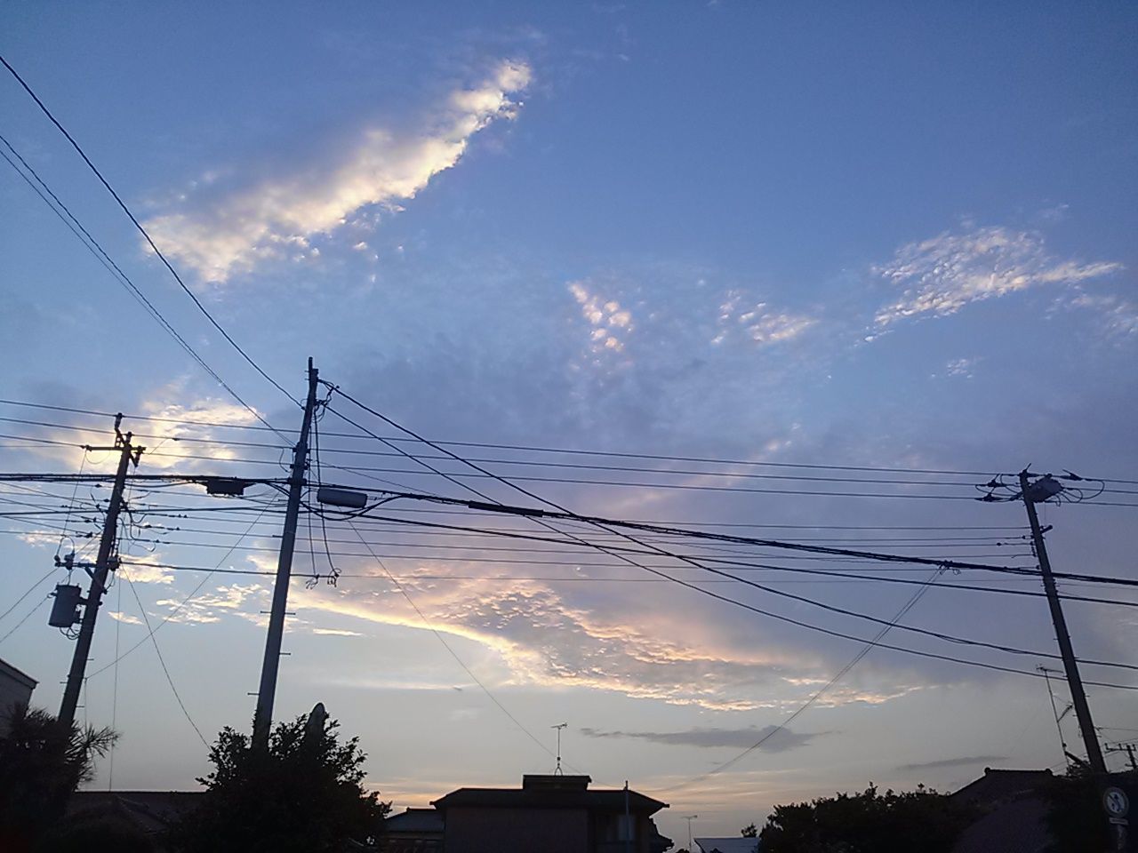 power line, electricity pylon, electricity, power supply, cable, low angle view, sky, connection, fuel and power generation, cloud - sky, power cable, built structure, technology, building exterior, silhouette, architecture, cloud, cloudy, outdoors, blue