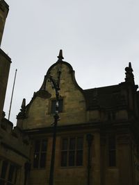 Low angle view of old building against clear sky