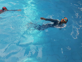 High angle view of person swimming in pool